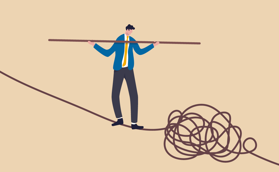 Man balancing on a line desktop